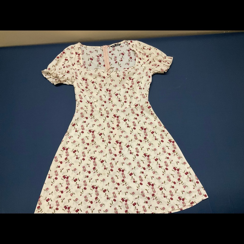 SHEIN dress in the size small, it is cream background with flowers on it.